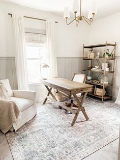 a living room filled with furniture and a rug