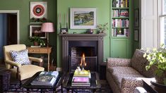 a living room filled with furniture and a fire place in the middle of a room