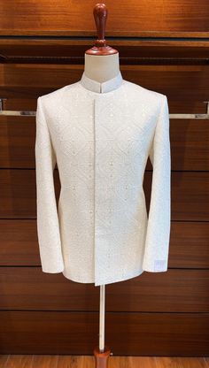 For the discerning groom, we present our opulent Off White Prince Coat. The base fabric is made of fine silk and is exquisitely unique due to the delicate floral embroidered design on it. This fabric, which is one of the best and rarest materials out there, will give your special day a hint of opulence. Adjustable to Your Desires You can alter the color and style of this amazing coat to fit your preferences. Our dedication to superior quality guarantees that each and every detail is flawless, re Prince Coat Design For Men, Prince Coat For Men, Marriage Outfit, India Fashion Men, Indian Wedding Suits Men, Jodhpuri Suits, Jodhpuri Suits For Men, Prince Coat, Wedding Dresses Men Indian