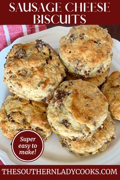 the southern lady cook's sausage cheese biscuits on a white plate with red and white checkered table cloth