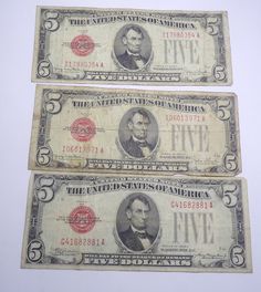 three bills with the image of abraham lincoln on them