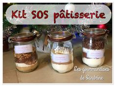 three glass jars filled with food sitting on top of a counter next to a christmas tree