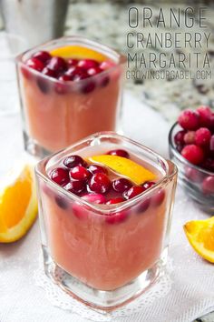 two glasses filled with cranberry and orange juice