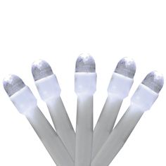 six white plastic toothbrushes on a white background