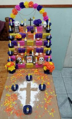 a decorated table with candles and flowers on it