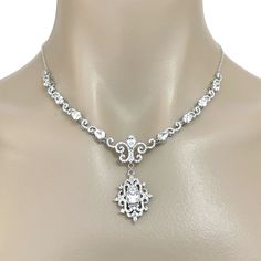 "A glamourous semi parure Victorian wedding vintage style bridal jewelry set with cz dangle earrings and statement necklace featuring intricately detailed Fleur de Lis Damask royalty inspired motifs. They are made of high quality clear cubic zirconia with earrings on sterling silver posts, all framed in white gold silver rhodium tarnish-resistant finish. Earrings are 1 3/8\" (3.5cm) including cz-studded sterling silver posts. Necklace length is adjustable at min 16.5\" (42cm) and max 18.5\" (47c Vintage Bridal Necklace, Gatsby Jewelry, Statement Necklace Wedding, Bridal Accessories Jewelry, Victorian Wedding, Wedding Vintage, Bridal Bracelet, Wedding Jewellery Necklace, Gorgeous Bracelet