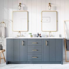 a bathroom with two sinks and mirrors on the wall next to each other in front of white walls