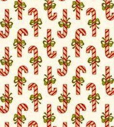 christmas candy canes on white fabric with green and red stripes, in the shape of letters