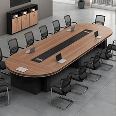 a large conference table with chairs around it