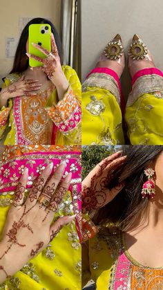 a woman in yellow and pink dress taking a selfie with her cell phone while wearing henna