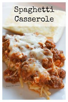 spaghetti casserole on a white plate with bread