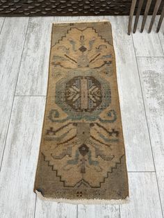 an old rug is laying on the floor