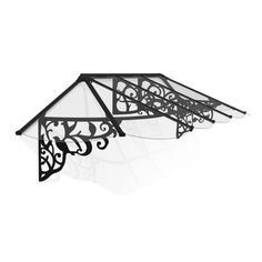 a black and white photo of an ornately designed glass awning over a window