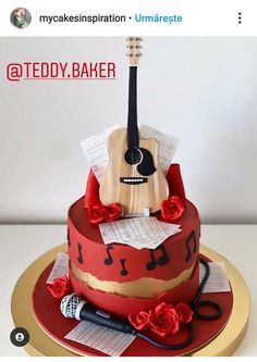 a red and gold cake with an acoustic guitar on top, surrounded by sheet music notes