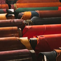 many different colored leathers are lined up together