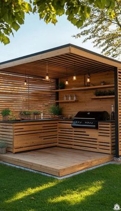 an outdoor kitchen is built into the side of a wooden structure with plants growing on it