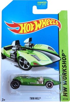 a green hot wheels car is in the package