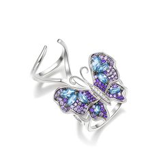 Our gorgeous flying butterfly ring, with its distinctive workmanship, pays tribute to the glamour and elegance of this creature. Through its graceful movement between your fingers, it recreates the fluttering charm of wings and adds unique enchantment to your femininity. Combing beautiful colors and asymmetry, this dazzling piece highlights eight brilliant marquise-cut blue stones, and smaller round stones in purple paved on wings. The multi-colored butterfly, fashioned in fine sterling silver, Elegant Winged Rings As Gifts, Elegant Winged Rings For Gifts, Elegant Sterling Silver Winged Rings, Luxury White Gold Butterfly Ring, Luxury Silver Butterfly Jewelry, Luxury Butterfly-shaped Ring For Gift, Luxury Butterfly Shape White Gold Jewelry, Luxury Butterfly White Gold Jewelry, Luxury Butterfly Rings For Gifts