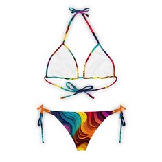 Dive into a world of vibrant colors and endless joy with our 'Rainbow Dreamland' classic bikini set from Mila Beachwear. Featuring a playful rainbow design, this set is sure to brighten up your beach days and make you stand out with its cheerful charm. Whether lounging by the pool or catching waves in the ocean, embrace the spirit of fun and freedom. Shop now and bring a touch of rainbow magic to your summer wardrobe with Mila Beachwear. -Our bikinis are made from a quality material offering maximum comfort and color vibrancy. This 100% original bikini is sure to make you stand out from the crowd. Get yourself ready for the bikini season; Made from 90% Polyester, 10% Spandex Available in XS, S, M, L, XL,2XL and 3XL sizes High Neck One Piece, Rainbow Magic, One Shoulder Swimsuit, Rainbow Design, In The Ocean, Beach Days, Beach Dresses, Beach Day, Summer Wardrobe