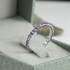 Amethyst Eternity Ring Gemstone Eternity Band As Gift, Elegant Amethyst Birthstone Ring In Round Band, Elegant Amethyst Birthstone Ring Round Band, Fine Jewelry Stackable Halo Rings, Elegant Amethyst Round Band Rings, Fine Jewelry Round Eternity Band As Gift, Elegant Amethyst Rings With Round Band, Fine Jewelry Halo Stackable Rings, Elegant Amethyst Round Rings