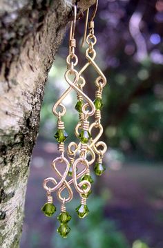 Handmade Wire Wrapped14k Gold Filled Chandelier Earrings Dainty Peridot Birthstone Crystal for an August Birthday. Large enough to be noticed, light enough to wear every day! These Peridot Chandelier Earrings are a little over 2 Inches long. Every single little gemstone is wire- wrapped one at a time, each pair of earrings take 2 hours to make! Please look at the picture and notice that the garnet buttons are free-form, hand cut, and not perfectly identical. We do not just use "pre-made" parts a Chandelier Earrings Diy, Dramatic Earrings, Peridot Birthstone, Gold Chandelier Earrings, Peridot Crystal, Crystal Chandelier Earrings, August Birthday, Prom Earrings, Holiday Earrings