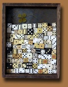 a wooden frame with many dices in it