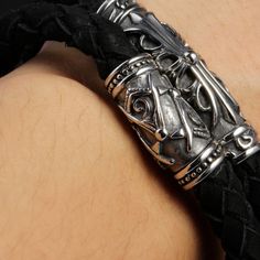 Elevate your style with our Knights Templar Commandery Bracelet! Inspired by the Knights Templar, this silver and black leather cross bracelet features a magnetic buckle for easy wear. Show off your devotion while making a statement. Perfect for any occasion, add it to your collection now!We ship worldwide to 185 countries! Please allow 1-2 business weeks for your order to arrive. Black Metal Wrap Bracelet For Gift, Adjustable Silver Braided Bracelet With Stainless Steel Clasp, Elegant Black Metal Wrap Bracelet, Adjustable Silver Leather Bracelet With Stainless Steel Clasp, Silver Bracelet With Black Band, Silver Leather Bracelet With Black Band, Silver Leather Bracelets With Black Band, Gothic Silver Metal Leather Bracelet, Silver Leather Bracelet With Stainless Steel Clasp