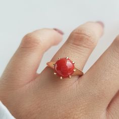 RING DETAILS: ✪Design: Gold ring ✪Gemstone: Natural coral ✪Gemstone color: Red ✪Gemstone size: 9mm Gemstone weight: 2.15mm ✪Gemstone shape: Round ✪Setting type: Prong Gold weight: 2 gram ✪Metal type: 14k solid yellow gold ✪Metal finish: Smooth shiny Choose your ring size from drop down menu and if you need any other preferred ring size please contact us. QUALITY OF MATERIALS: Metal: Most of our jewelry at JewelryMansion is made with precious metals like gold and silver. These metals are 100% non 14k Gold Red Cabochon Ring, 14k Gold Rings With Red Cabochon, 14k Gold Cabochon Red Ring, Red Jewelry With Round Stone In Prong Setting, Red Rings With Prong Setting, Red Ring With Prong Setting, Red Cabochon Ruby Ring In 14k Gold, 14k Gold Red Cabochon Ruby Ring, Red Cluster Ring With Round Cut For Gift