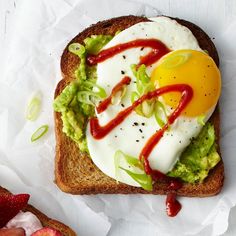 an egg and avocado toast with strawberry sauce