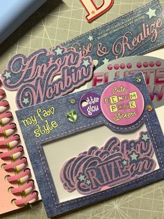 a scrapbook with some stickers on top of it