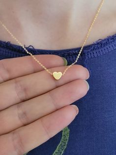 Tiny Heart Necklace, Gold Plated, Heart Pendant, Dainty, Minimalist, Girlfriend, Love, Bridesmaid Gift, Gift for Her, Gold Heart, Custom Beautiful minimalist gold plated heart necklace. The heart measures approximately 7 mm and it moves freely on the chain. Also a perfect gift for your bff, your bridesmaids, or a special person in your life. Details: Materials: gold plated brass Necklace length: please choose size when checking out. Charm Size: 7 mm Extender chain: 2 cm The listing is for 1 neck Simple Heart Necklace For Mother's Day, Simple Heart Charm Necklace For Mother's Day, Simple Heart Necklace For Valentine's Day, Valentine's Day Heart Pendant Necklace For Bridesmaid, Heart Necklace For Bridesmaid Gift On Valentine's Day, Valentine's Day Bridesmaid Gift Charm Necklaces, Heart Charm Necklace For Bridesmaid Gift, Heart Charm Necklace For Bridesmaid, Valentine's Day Gift, Valentine's Day Bridesmaid Gift Heart Charm Necklace