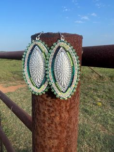 Beautiful beaded earrings. Teal, green and white colors. They are made with size 13 beads and backed with deerskin leather. They are large but lightweight. Handmade Southwestern Green Earrings, Handmade Southwestern Green Beaded Earrings, Southwestern Green Beaded Dangle Earrings, Artisan Adjustable Green Beaded Earrings, Southwestern Green Earrings With Colorful Beads, Southwestern Style Green Earrings With Colorful Beads, Artisan Green Beaded Earrings Nickel Free, Green Large Beaded Earrings For Festival, Southwestern Green Beaded Dangling Earrings