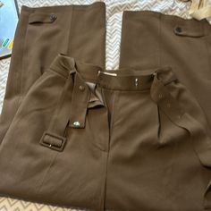 The Frankie Shop Wide Leg Trousers. In A Greenish Dark Tan Color Belted. Button Detail At Hem. Size Large. Excellent Condition The Frankie Shop Jumpsuit, Dark Tan Color, Shop Pants, The Frankie Shop, Frankie Shop, Dark Tan, Jumpsuit Trousers, Tan Color, Button Detail