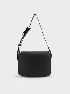 A nifty front-flap bag will always come in useful, especially when they are as minimalist as this one. The clean lines of the boxy shape, especially in jet black, makes it an effortless accessory to add to almost any outfit. As a distinctive element, the utilitarian buckle on the strap add a distinctive touch, and also makes the strap adjustable to your preferred carrying length. Flap Shoulder Bag, Charles Keith, Flap Bag, Jet Black, Clean Lines, Buckle, Shoulder Bag, Handbags, Black