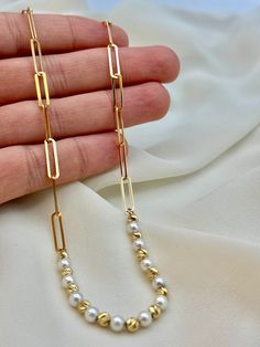 18k real Gold paper clip necklace  with cultured pearls  ,19" ,4mm, 7.27 gr(weight of gold only) 18k real Gold paper clip  bracelet with cultured pearls  ,7.2",4mm, 3.27 gr(weight of gold only) Please be advised That  half of the necklace is paperclip links and the other half is  orb diamond cut mixed with pearl . Priced to sell! Compare our prices to other similar sellers! Arrives in a GIFT BOX and includes FREE SHIPPING within the USA and Canada. International shipping is available at the most Minimalist Gold Pearl Necklace With Paperclip Chain, Gold Pearl Necklace With Paperclip Chain, Elegant 14k Gold-filled Jewelry With Paperclip Chain, Modern Gold-plated Paperclip Chain Necklace, Elegant 14k Gold-filled Necklace With Paperclip Chain, Men's Necklace Gold, Gold Necklace For Men, 14k Yellow Gold-filled Pearl Necklace With Adjustable Chain, Real Gold Chains