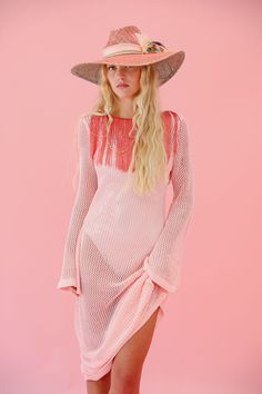 Introducing THE MARINA KNIT DRESS: a light pink long-sleeve crochet cover up dress with coral fringe detailing around the neckline and a playful scoop back. Stay stylish and comfortable in this unique and quirky dress. Perfect for a day at the beach or a fun night out. All orders are currently shipping within 14 business days. To receive item quicker, expedited shipping is available at checkout. Crochet Cover Up Dress, Quirky Dress, Crochet Cover, Sleeve Crochet, Crochet Cover Up, Baseball Trucker Hat, Usa Dresses, Bride Accessories, Day At The Beach