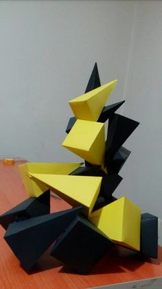 an abstract sculpture is sitting on a table