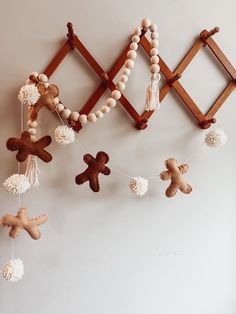 a group of wooden toys hanging from a wall