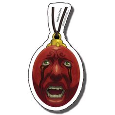 a red ornament with an evil face on it's front and side