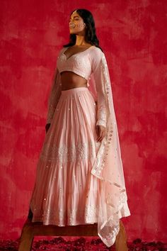 Blush pink tiered lehenga with all over diamonte bloom thread and mirror embroidery. Paired with a matching embroidered full sleeves sweetheart neck blouse and dupatta. - Aza Fashions Wedding Choli With Tiered Skirt For Festivals, Festive Pink Sets With Tiered Skirt, Festive Pink Tiered Skirt Sets, Pink Long Sleeve Choli With Mirror Work, Pink Long Sleeve Blouse With Cutdana, Pink Mirror Work Lehenga, Pink Semi-stitched Lehenga With Cutdana, Semi-stitched Pink Embroidered Fabric With Mirror Work, Sweetheart Neck Blouse