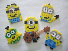 four minion bead magnets made to look like cartoon characters