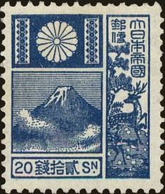 an old stamp with the image of mount fuji in blue and white, on a black background