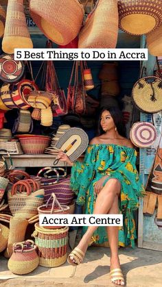 a woman is sitting in front of baskets