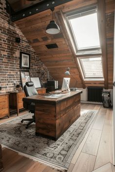 an attic office with exposed brick walls and wooden floors, along with a rug on the floor