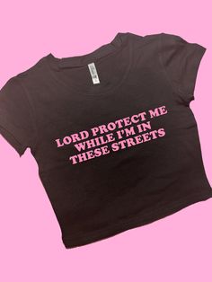 In These Streets SNUG FIT Crop Top | Cute Crop Top | Graphic Top | Gift For Her | Y2K  Tee | Y2K crop top | Gift for friend | Baby Tee Comfy Top to Lounge in! Actual item may be lighter/darker than pictured. M A T E R I A L S - SNUG FIT - 100% RING SPUN COTTON - Shoulder Taping S I Z I N G - Size chart is available on our listing photos. S H I P P I N G  &  P R O D U C T I O N  T I M E - Production Time is 5 Business Days. (May be delayed during the Holiday Season) - Shipping Time is 2-6 Busines Trendy Stretch Crop Top For Streetwear, Trendy Stretch Cropped T-shirt For Streetwear, Y2k Fitted Crop Top With Funny Text, Fitted Y2k Crop Top With Funny Text, Fitted Casual Crop Top With Funny Text, Fitted Black Crop Top Band Merch, Trendy Crew Neck Crop Top For Streetwear, Fitted Y2k Crop Top With Text Print, Fitted Graphic Tee Crop Top With Text Print