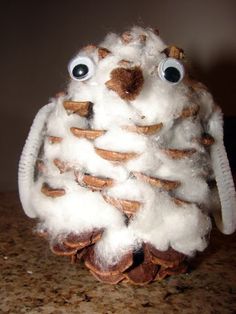 a stuffed animal made out of cotton sitting on top of a table