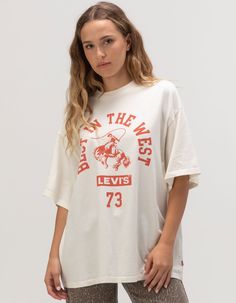 Levi's Best In The West Premium Tee. Large Graphic Screened On Front. Ribbed Crew Neckline. Short Sleeve. Oversized Fit. 100% Cotton. Machine Wash. Imported. Model Is Wearing A Size Small. Model Measurements:height: 5'9" Bust: 32"waist: 25"hips: 35"