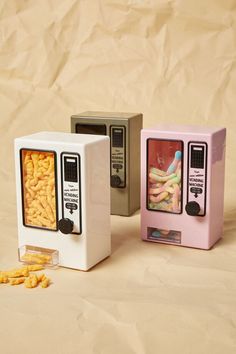 three different types of microwaves with cereal in them and one is filled with macaroni and cheese