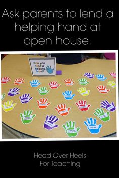 a table topped with lots of hand prints and a sign that says ask parents to lend a helping hand at open house