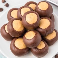 a white plate topped with chocolate covered cookies